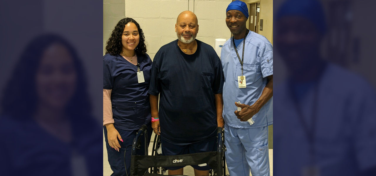 Happy patient leaving hospital with caregivers