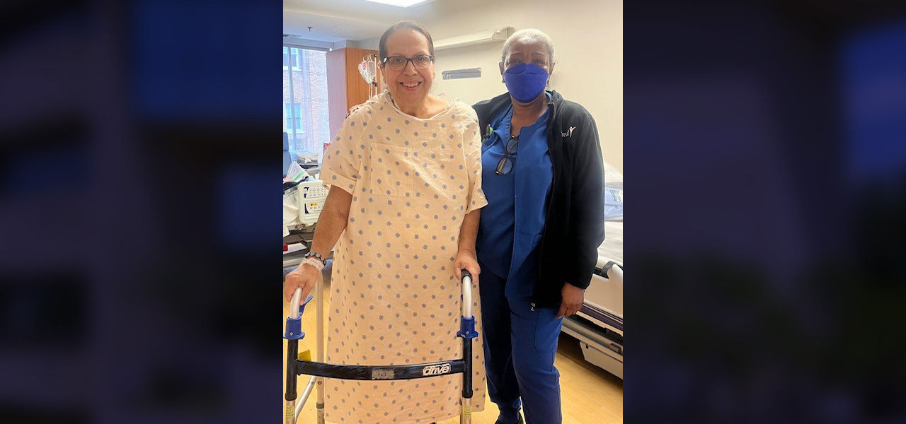 Kindred Hospital San Antonio Central patient Martha stands with her caregiver
