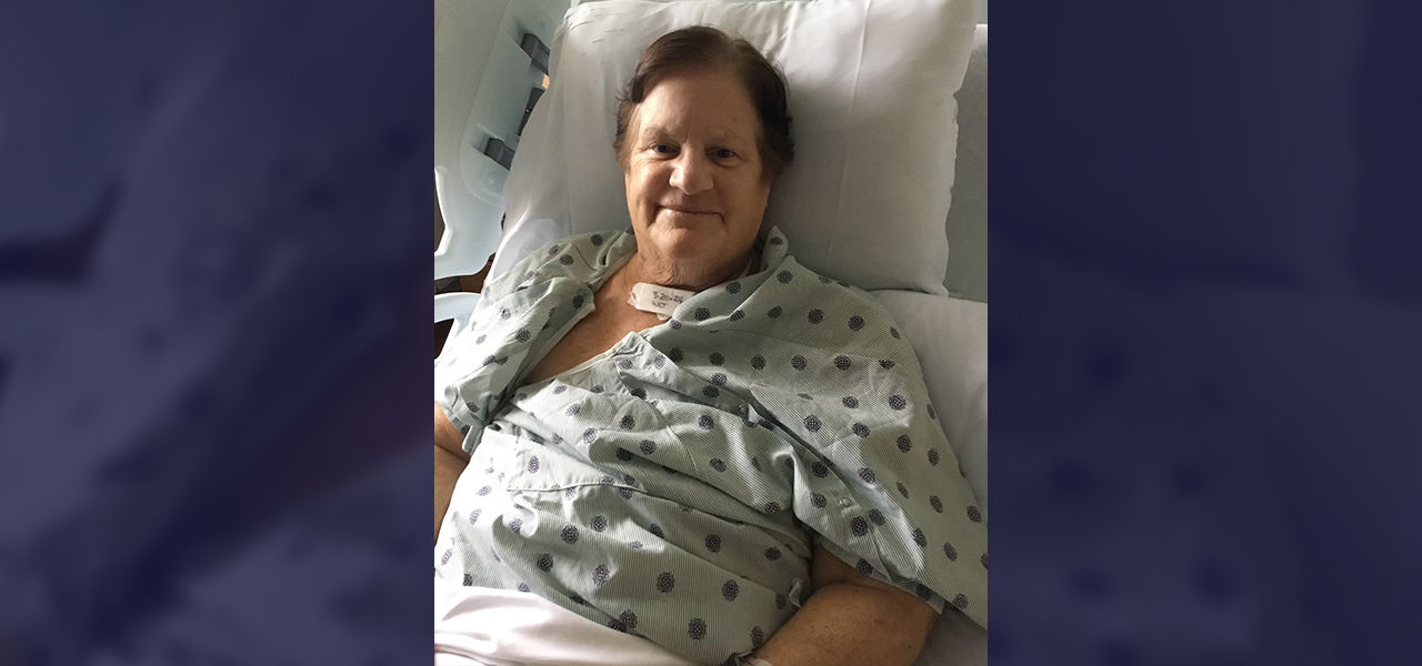 Happy patient leaving hospital with caregivers