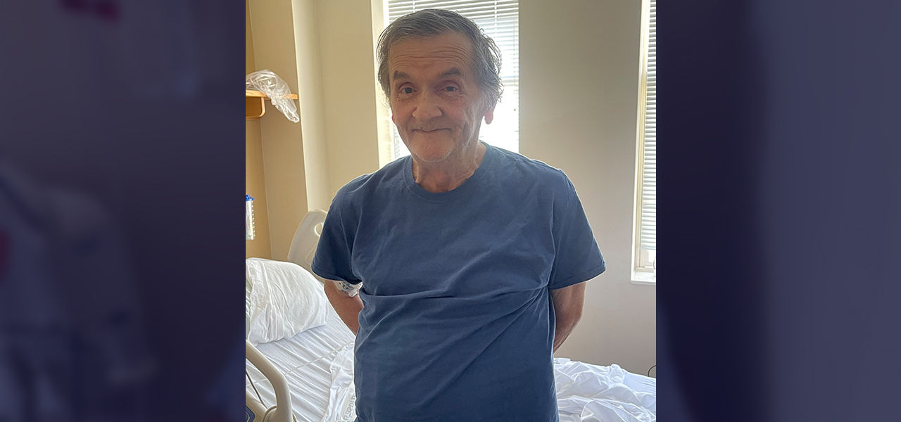 Happy patient leaving hospital with caregivers