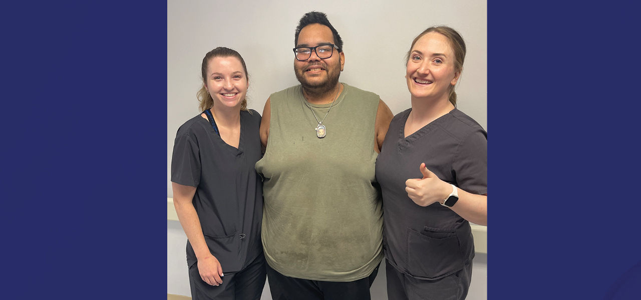 Kindred Hospital Chicago North patient Miguel poses with his caregiver team