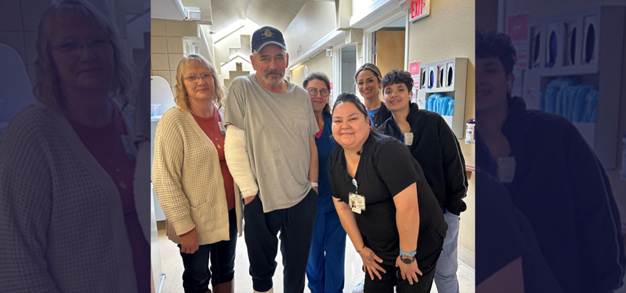 Happy patient leaving hospital with caregivers