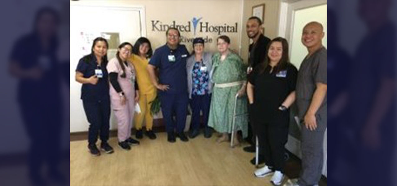 Happy patient posing with caregivers