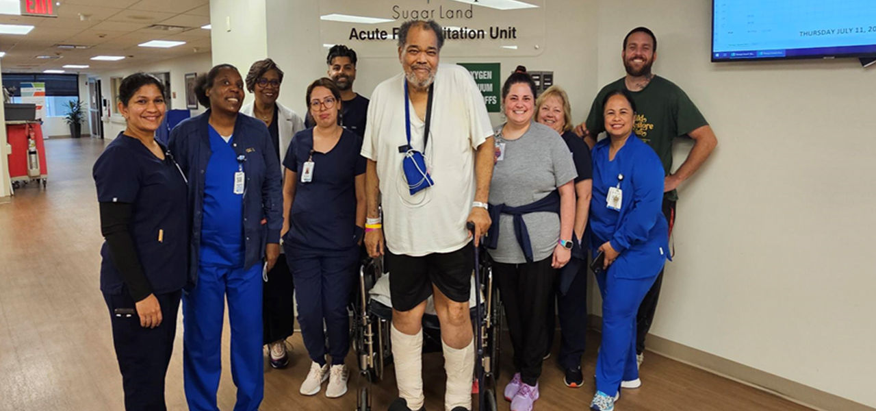 Happy patient leaving hospital with caregivers
