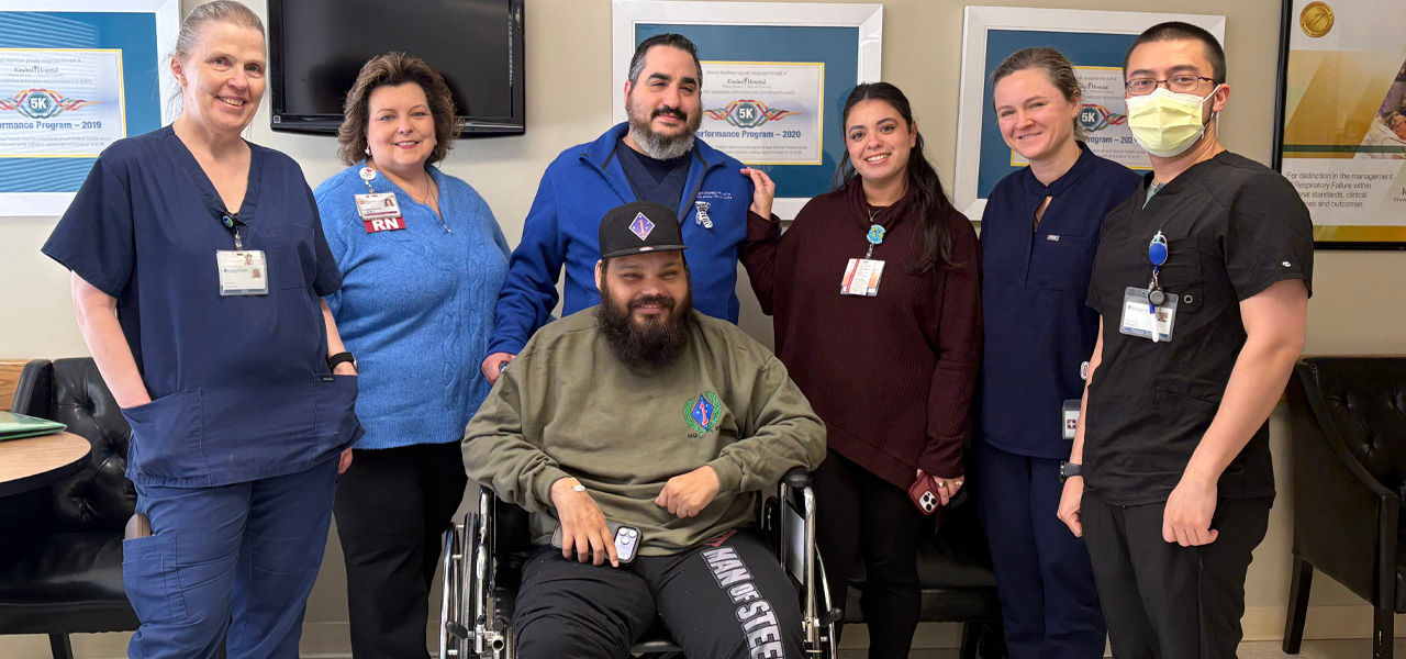 Kindred Hospital New Jersey Morris County patient Rigoberto poses with his care team and shares his story of recovery