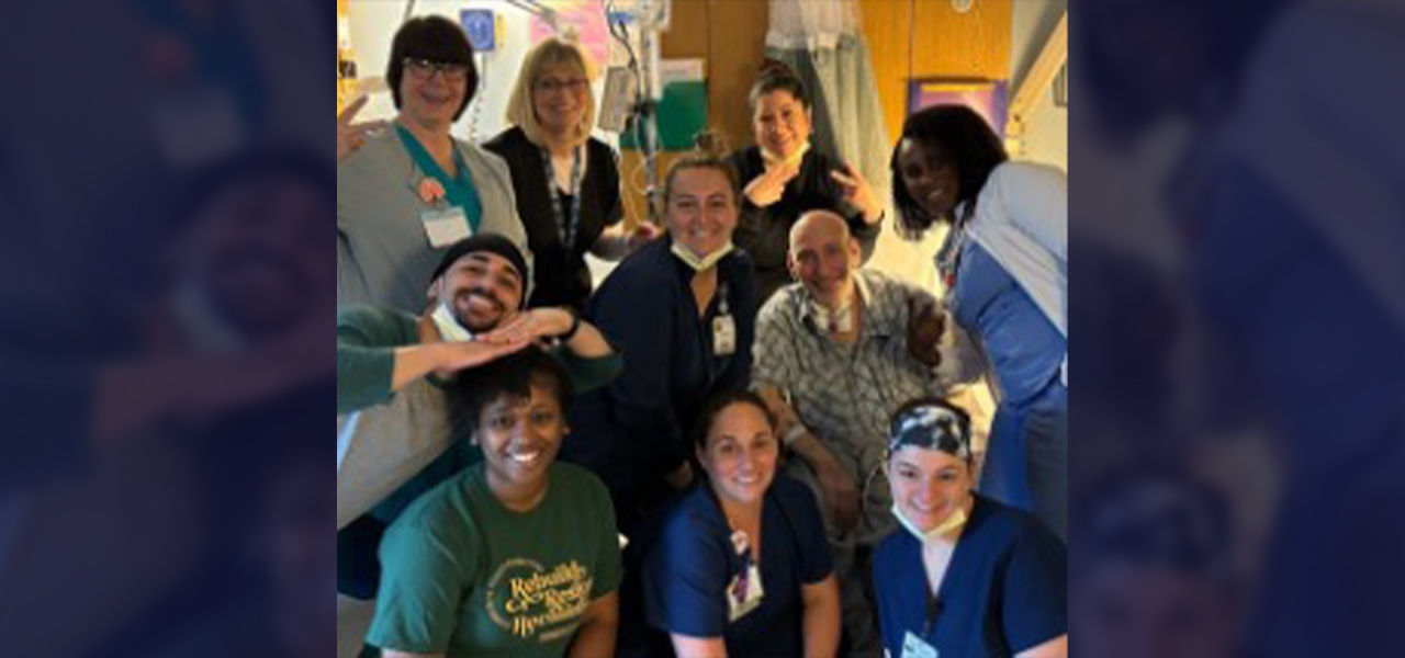 Happy patient leaving hospital with caregivers