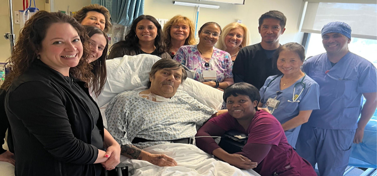 Kindred Hospital Morris County patient Rocco poses with his care team
