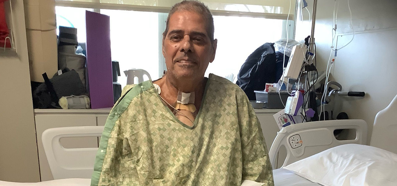 Happy patient leaving hospital with caregivers