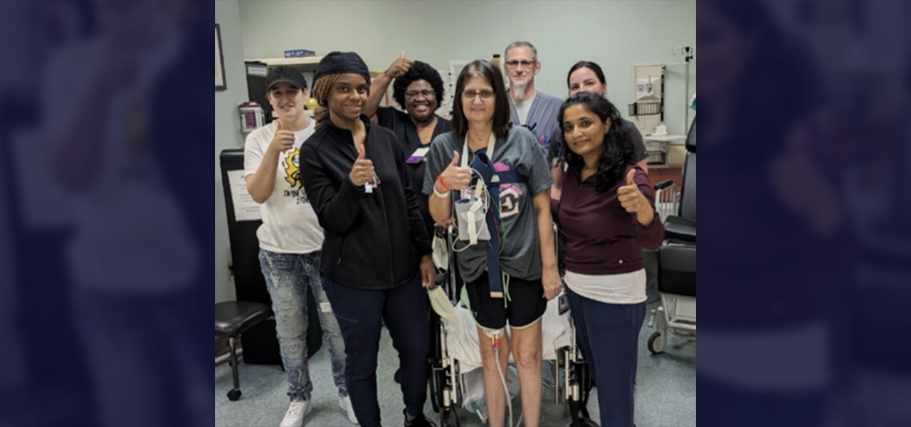 Happy patient leaving hospital with caregivers