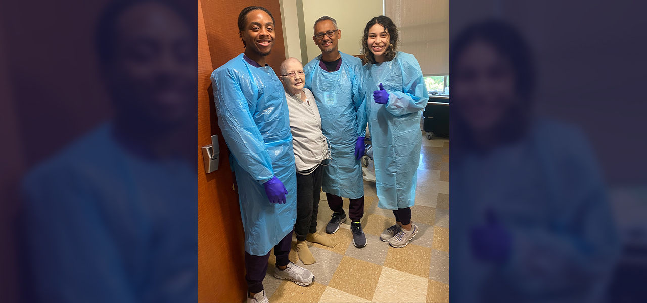 Happy patient leaving hospital with caregivers