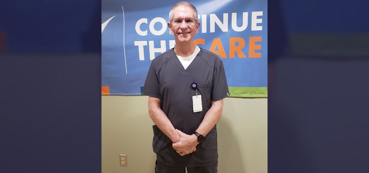 Happy patient leaving hospital with caregivers