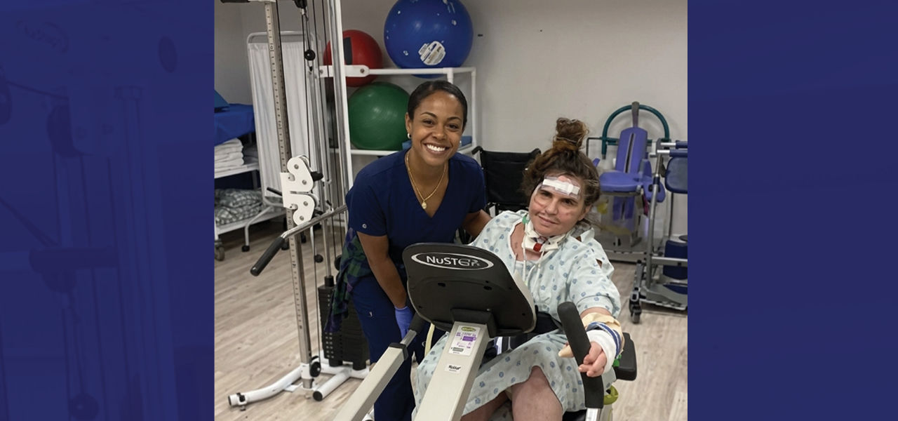 Kindred Hospital South Florida Coral Gables patient Wendy poses with her caregiver in the therapy gym